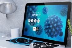 Image of laptop with Coronavirus COVID-19 text on screen