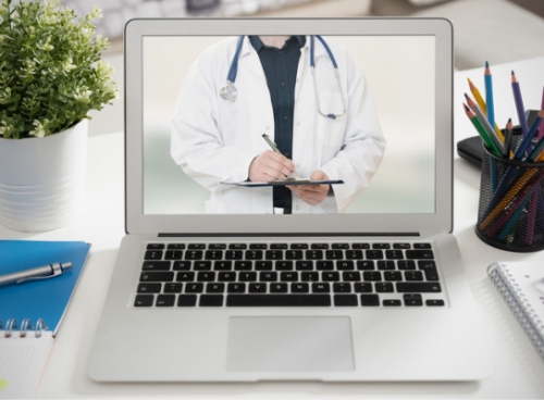 Image of doctor on laptop screen
