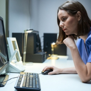 Image of Female Healthcare worker looking at computer screen